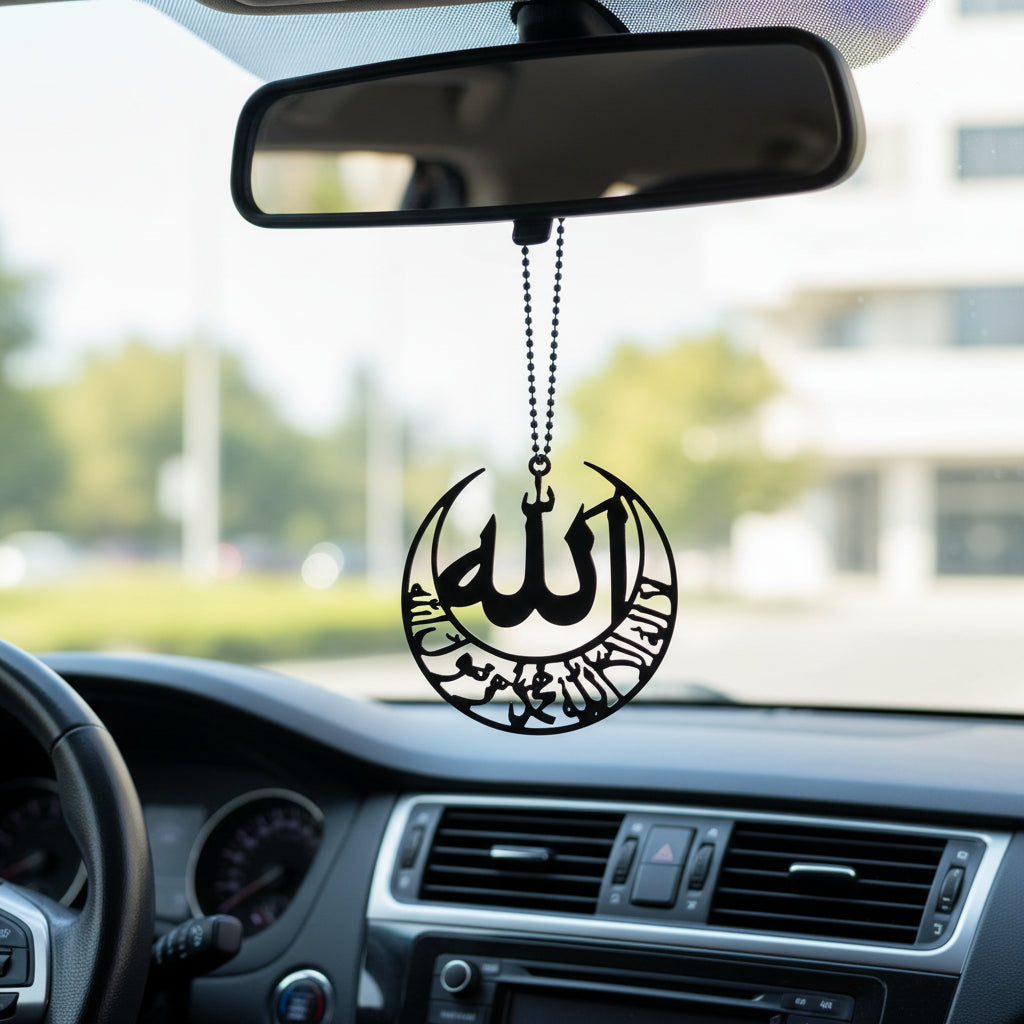 Black pendant with Arabic calligraphy on a white background