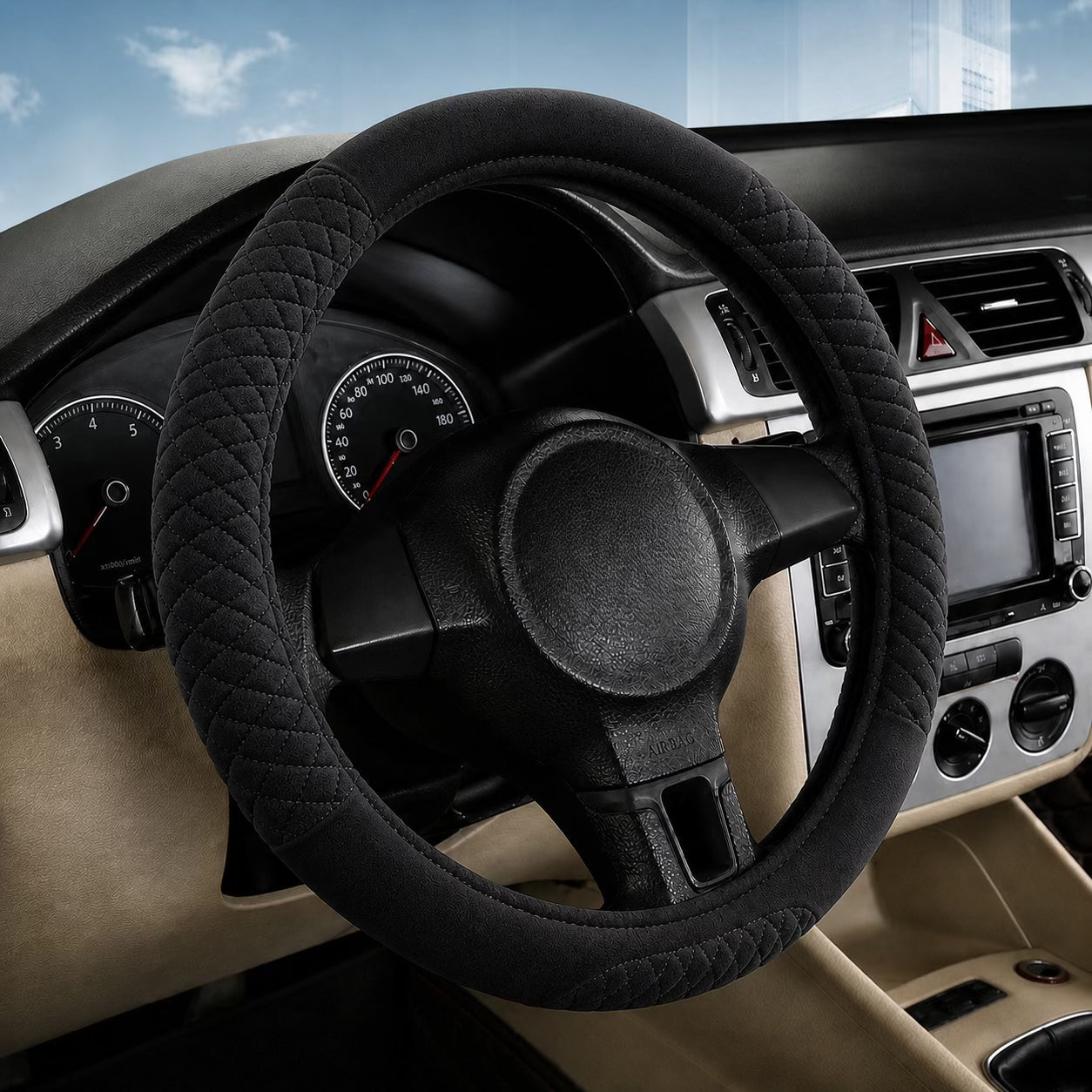 Steering wheel cover on a car steering wheel with dashboard in the background