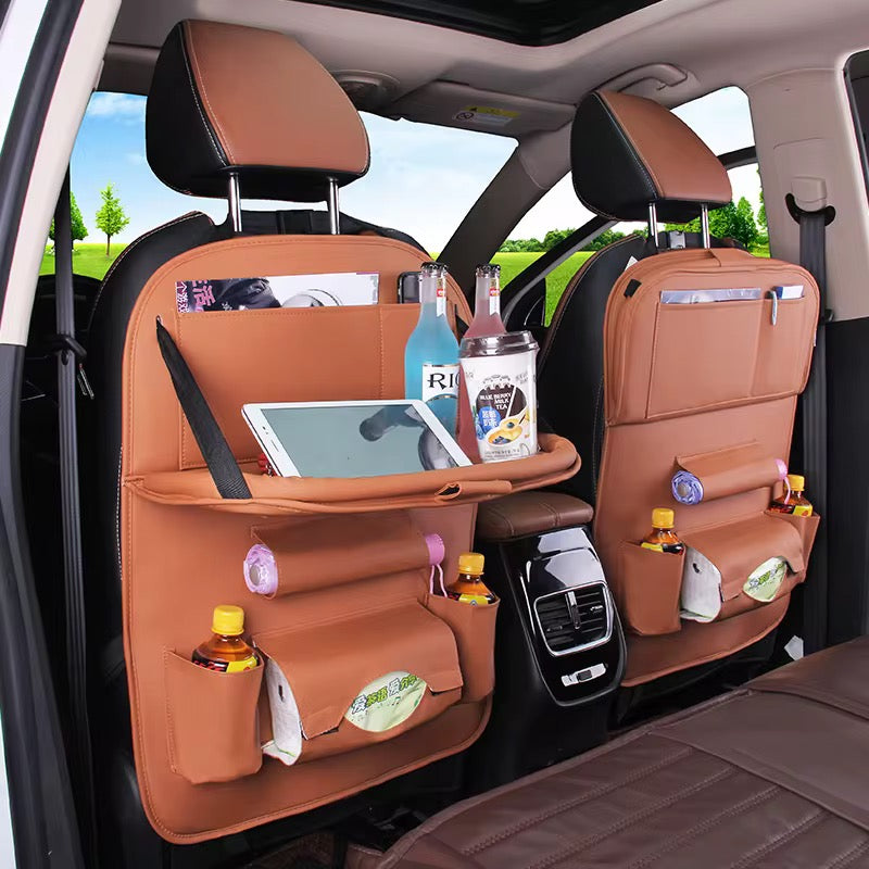 Car back seat organizer with multiple pockets and items inside, showing its functionality. PU Leather Back Seat Organizer with tray-منظم المقعد الخلفي من جلد البولي يوريثان مع صينية-Auto-Emporio-Kuwait.0