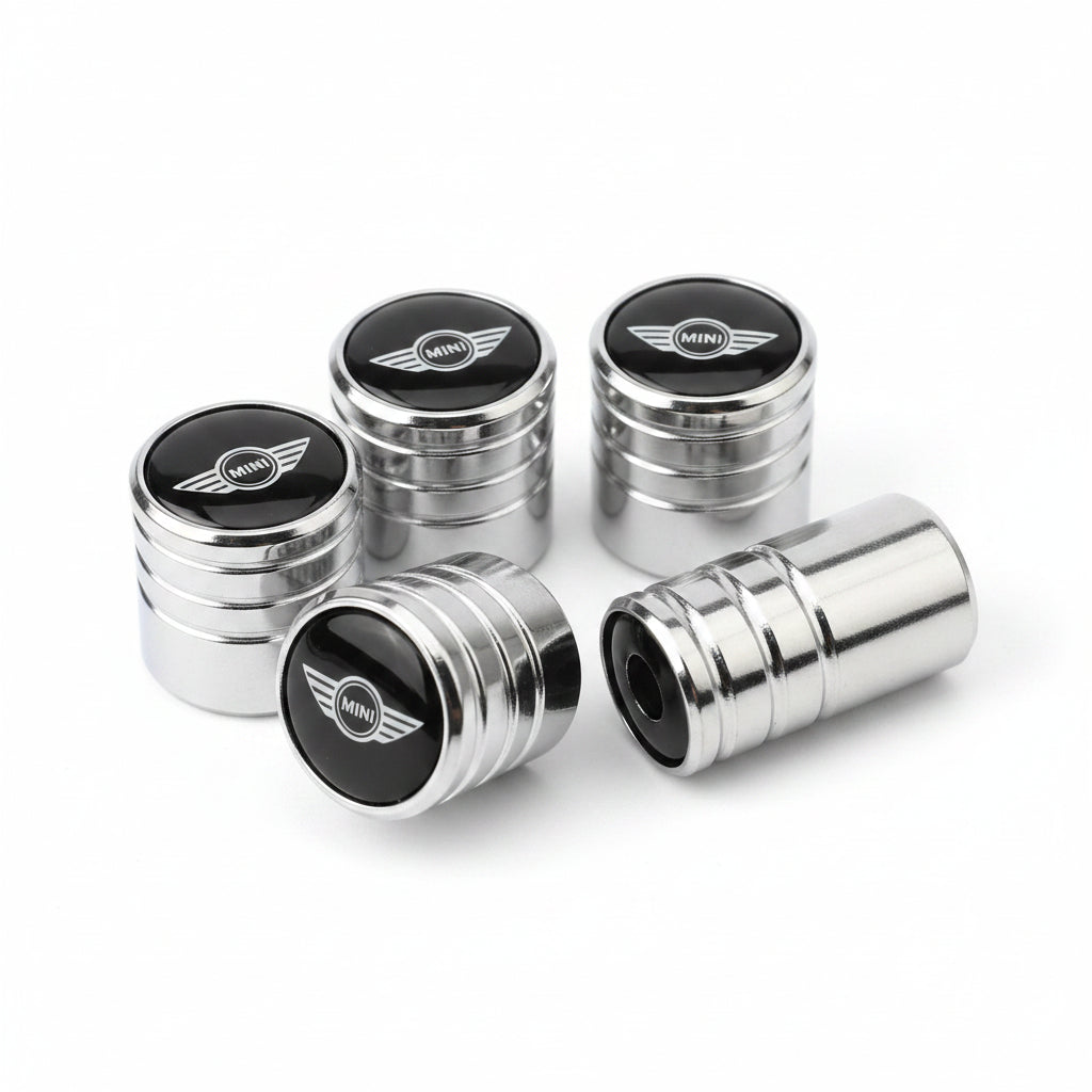 Metallic car valve stem caps with a logo on a white background