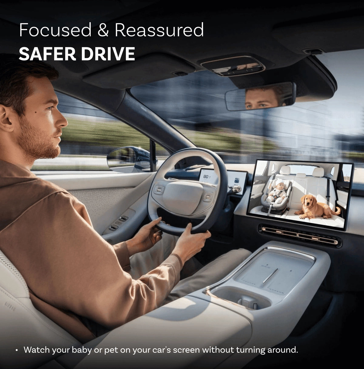 Person driving a car with a screen displaying a baby and a dog, emphasizing a safer drive.